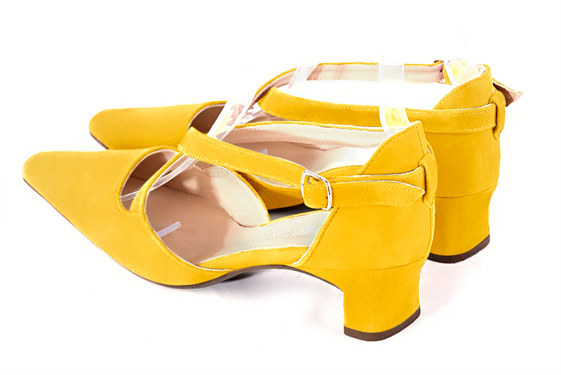 Yellow women's open side shoes, with crossed straps. Tapered toe. Low kitten heels. Rear view - Florence KOOIJMAN